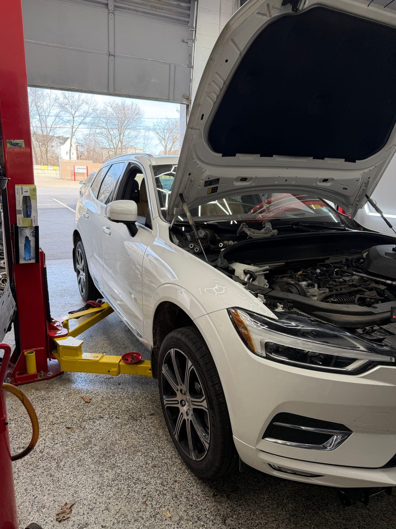 A vehicle on the lift in the Pro Tech Auto service bay during a repair.